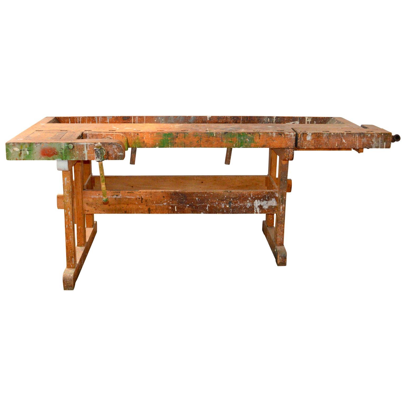 Danish carpenters' workbench, bearing an incredible patina after years of traditional use. Please examine the close up photos. It has two wooden vices with wood handle and a recessed tray where the carpenter would lay his tools. The traditional