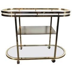 Mid-Century Modern Oval Polished Brass and Mirror Three-Tier Bar Cart on Casters