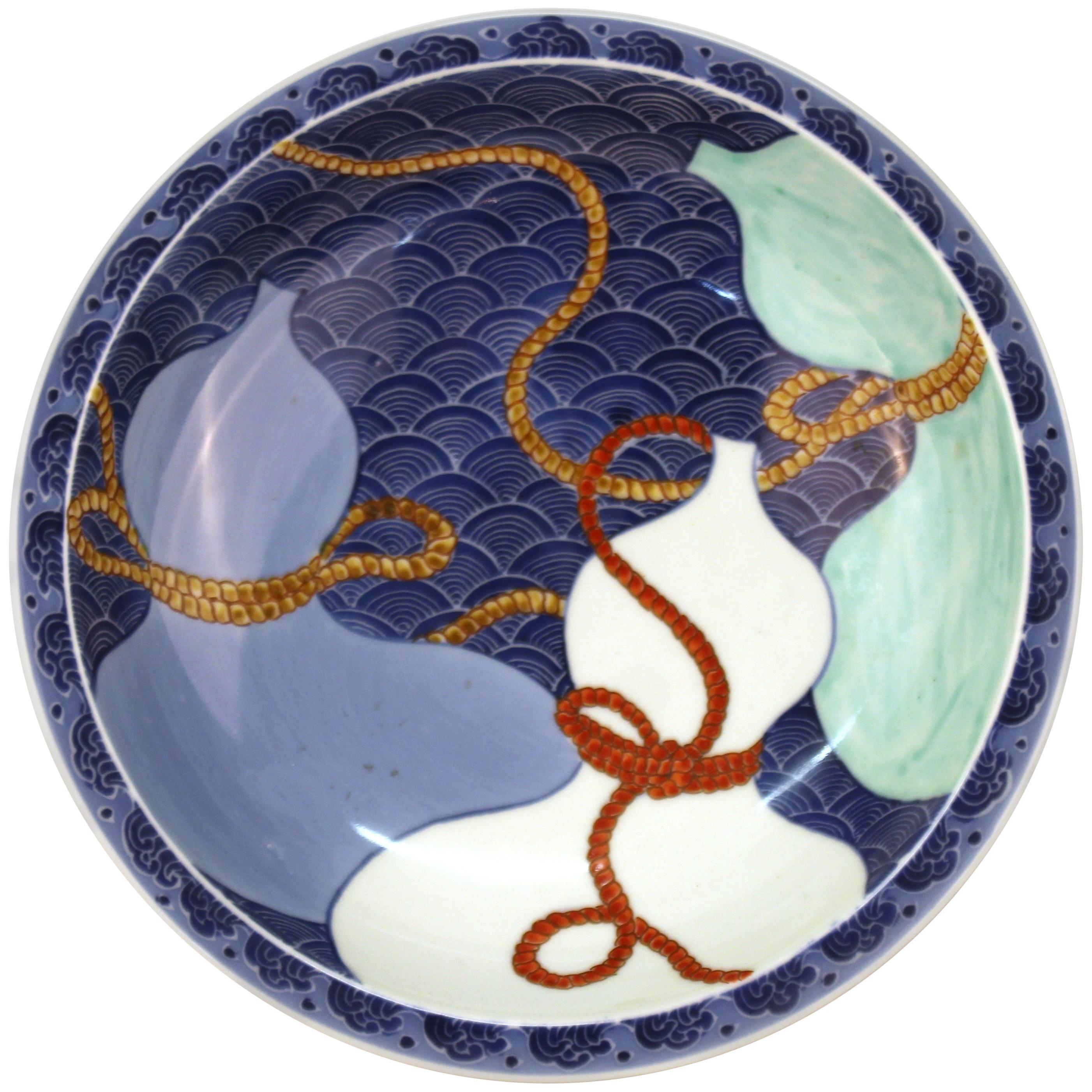 Japanese Nabashima Porcelain Blue Plate with Three Sake Bottle Motif For Sale