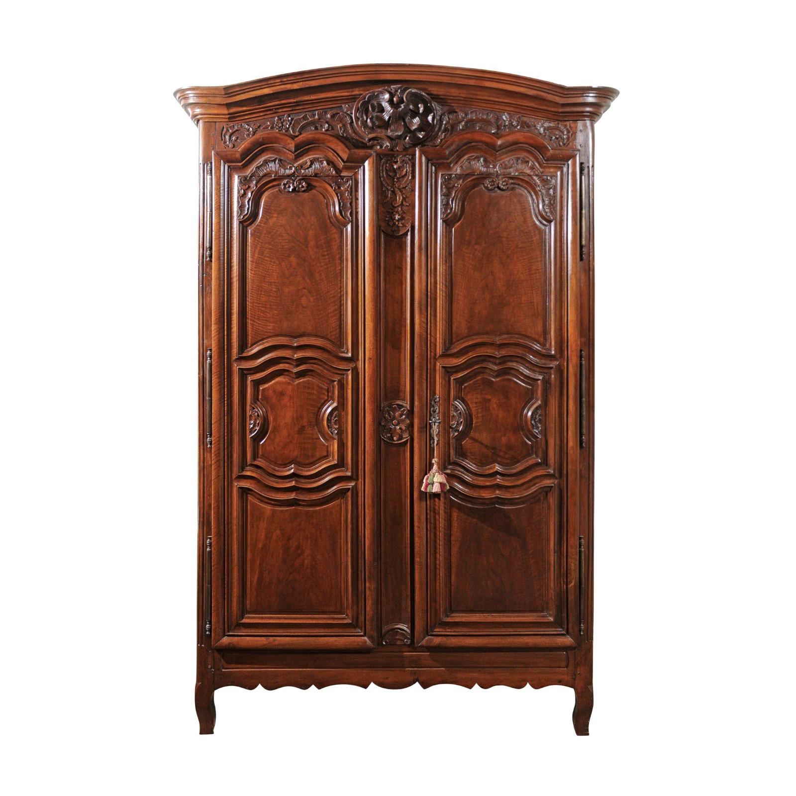 French Mid-18th Century Walnut Louis XV Lyonnaise Armoire with Carved Shell