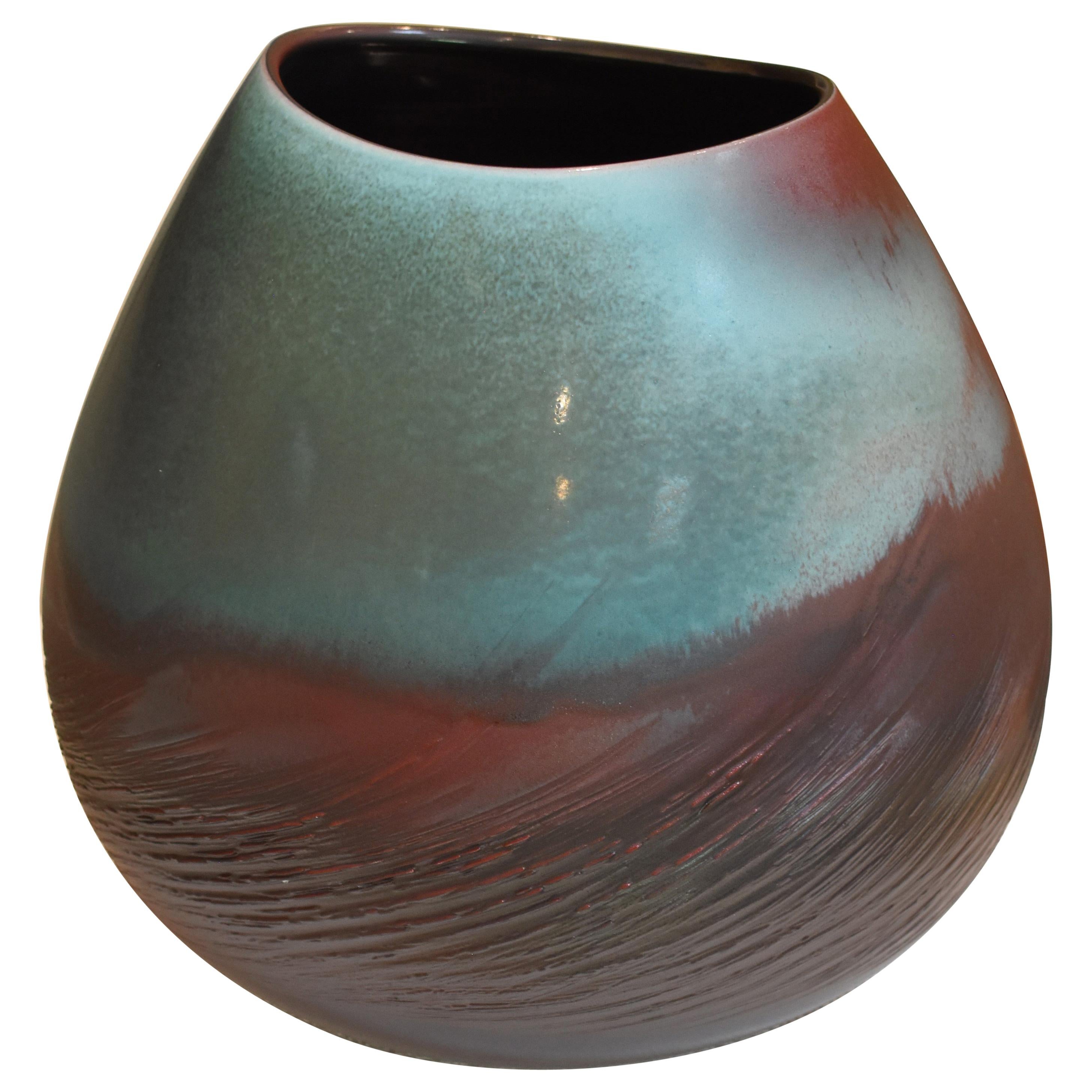 Extraordinary Jpanese contemporary highly collectible hand-glazed decorative porcelain vase, a museum quality exhibition piece hand-glazed in iron red/brown and turquoise blue on a strikingly shaped body, an award-winning exhibition masterpiece by