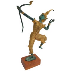 Vieille figurine thaïlandaise en bronze:: or et vert représentant le prince Rama avec un arc