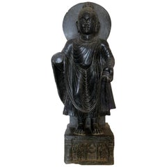 1980s Black Marble Hand Carved Standing Buddha Sculpture with Relief on the Base