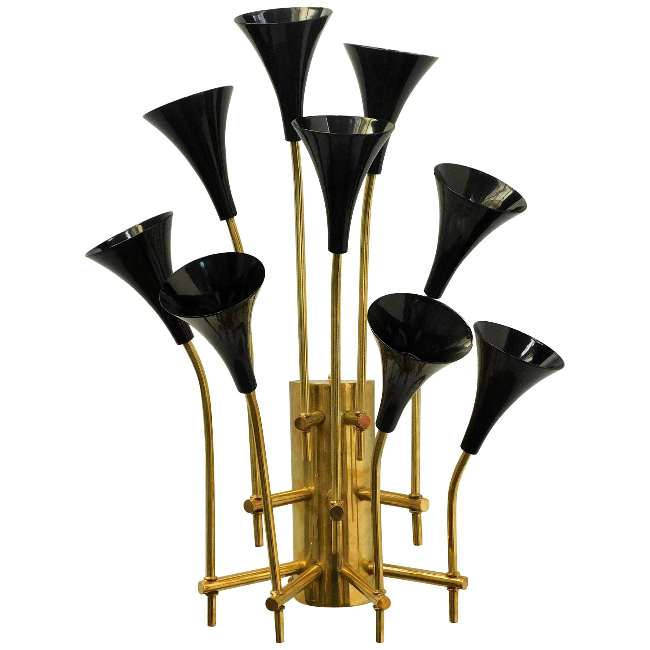 Limited edition Italian wall lights with nine black enameled metal trumpets mounted on polished brass frames / Designed by Fabio Bergomi for Fabio Ltd / Made in Italy
9 lights / E12 or E14 type/ max 40W each
Measures: Height 31 inches / Width 23