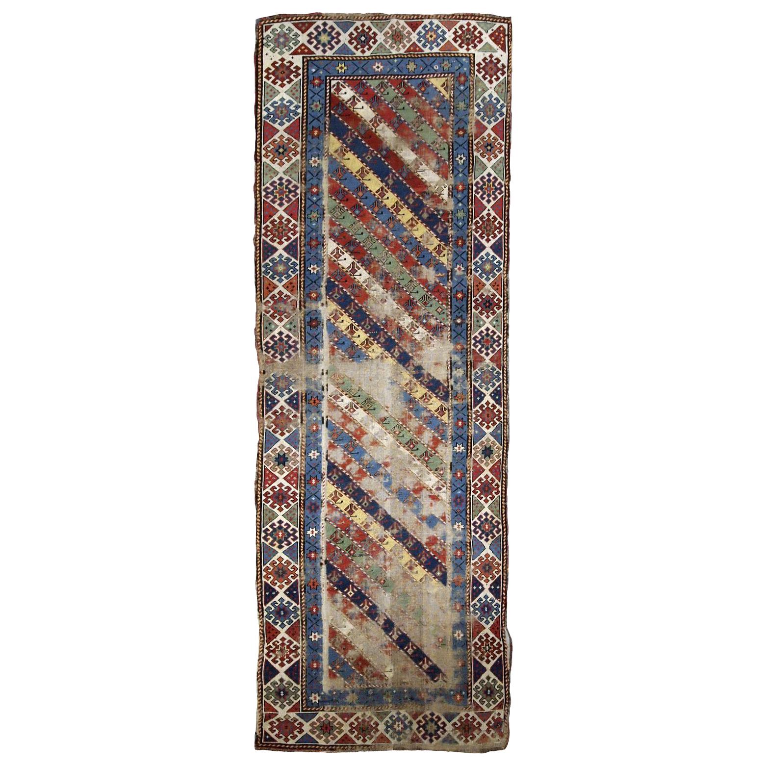 Handmade Antique Distressed Caucasian Gendje Rug, 1870s, 1B717 For Sale