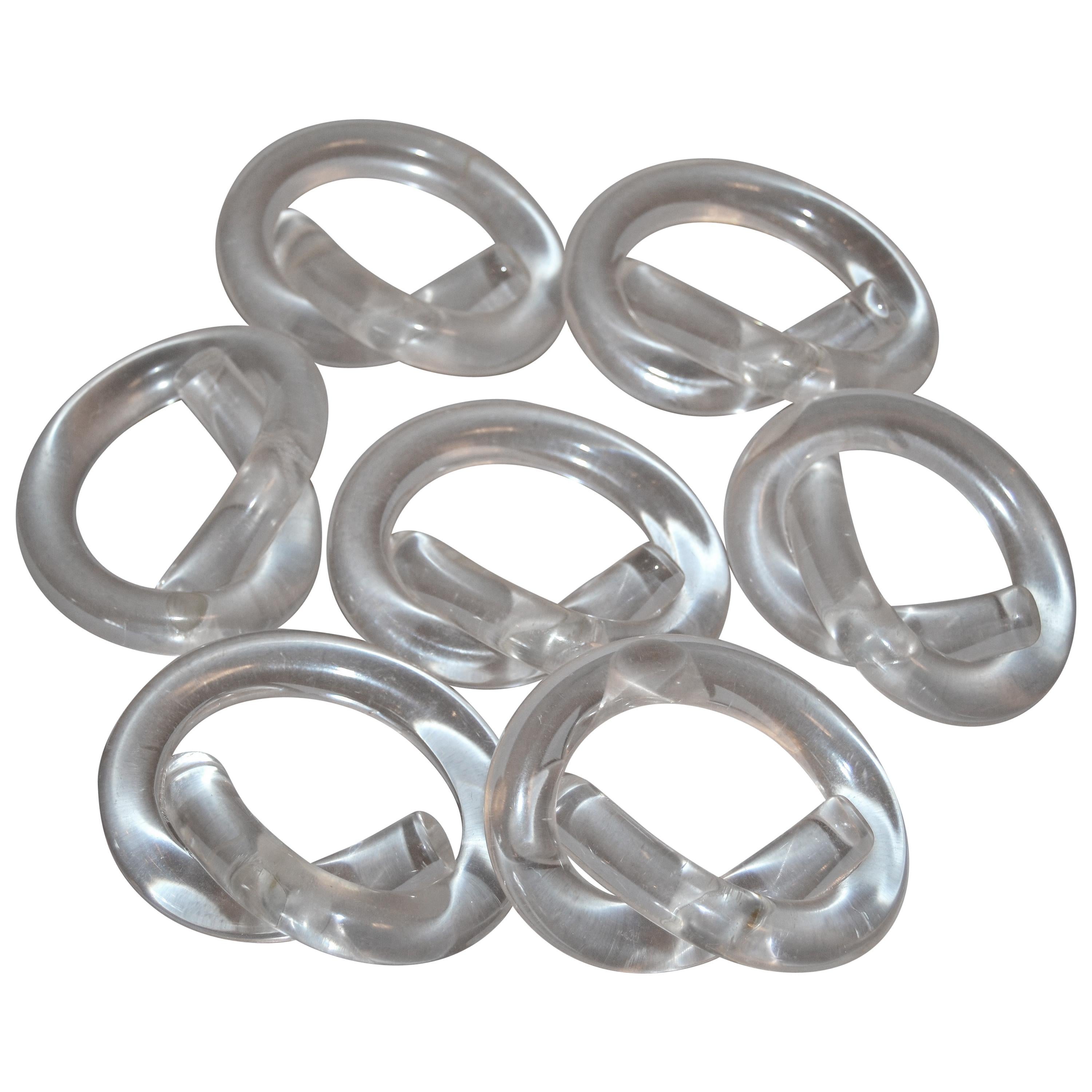 Seven Dorothy Thorpe Lucite Napkin Rings in Pretzel Shape