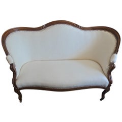 English Stained Walnut Love Seat with White Woven Cotton on Four Wood Castors