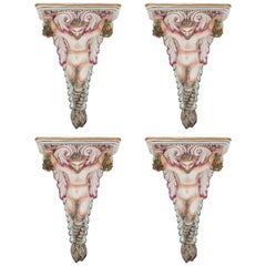 Four Decorative Porcelain Wall Brackets of Satyr Form