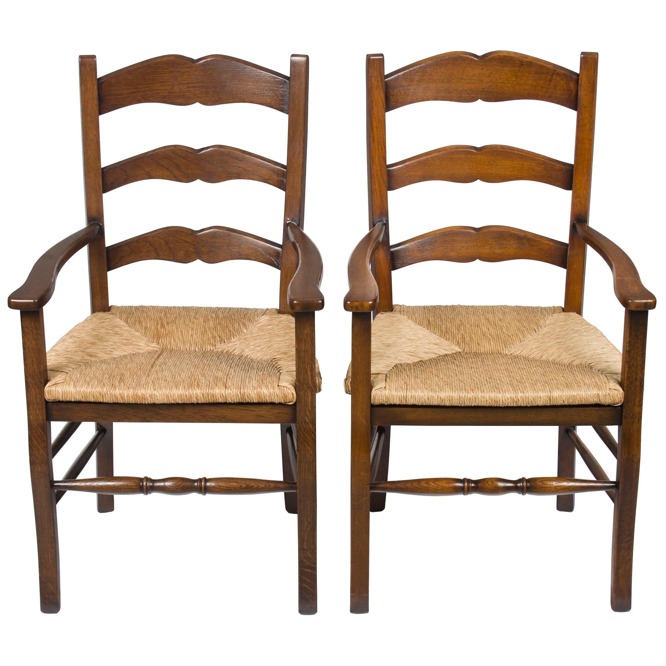 Pair of Solid Oak Rush Seat Ladder Back Dining Room Armchairs For Sale