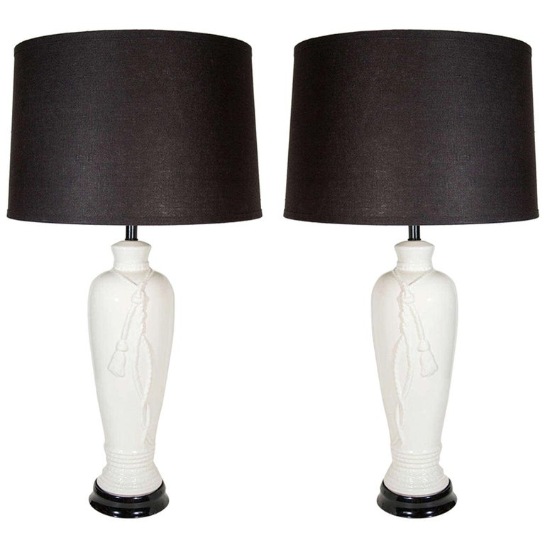 Pair of Hollywood Regency Porcelain Lamps with Rope and Tassel Design For Sale