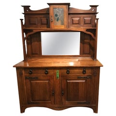 Antique English Arts & Crafts Oak Sideboard with Stained Glass and Carved Decoration