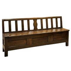 Mid-19th Century Chestnut Settle with lift up lid and low back