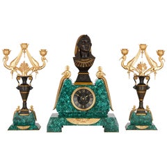 Egyptian Revival Malachite, Marble, Gilt and Patinated Bronze Clock Set
