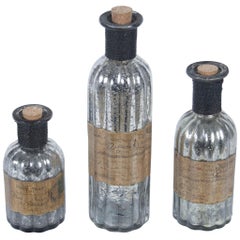 Tarnished Silver Set of Three Decorative Bottles