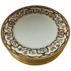 Ensemble de sept assiettes plates en porcelaine fine Christian Dior Renaissance