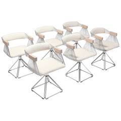 Chaises pivotantes postmodernes en fil d'acier chromé avec assise en laine ivoire