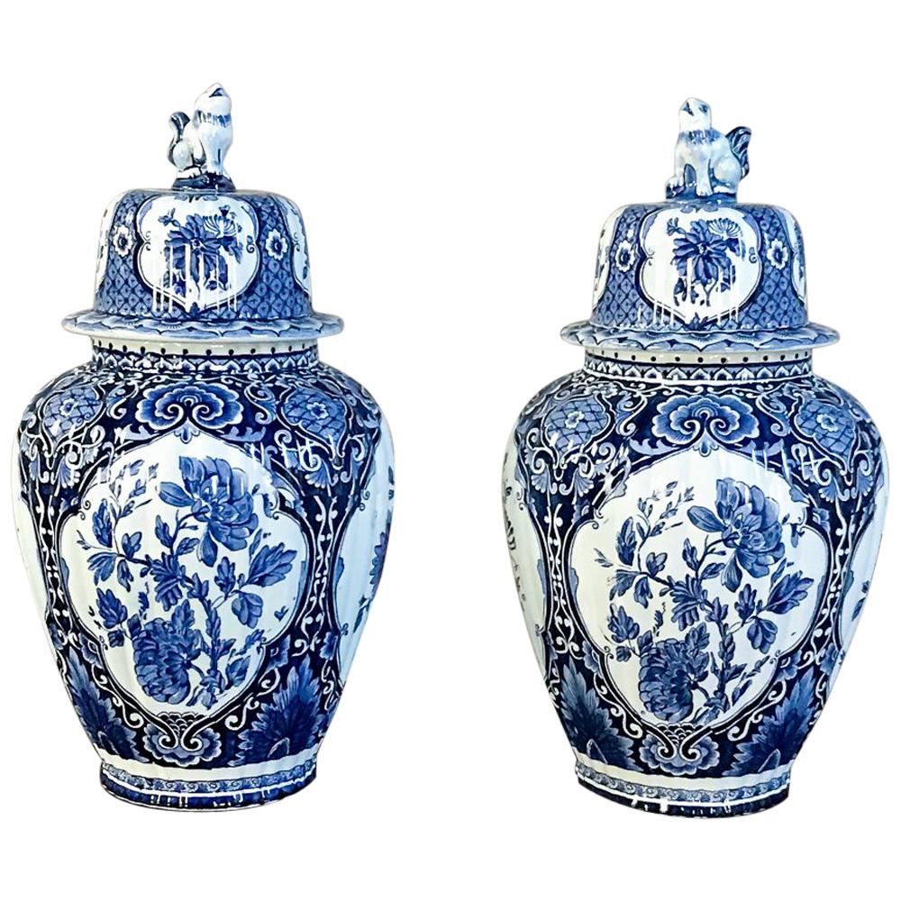 Pair of 19th Century Blue and White Lidded Vases