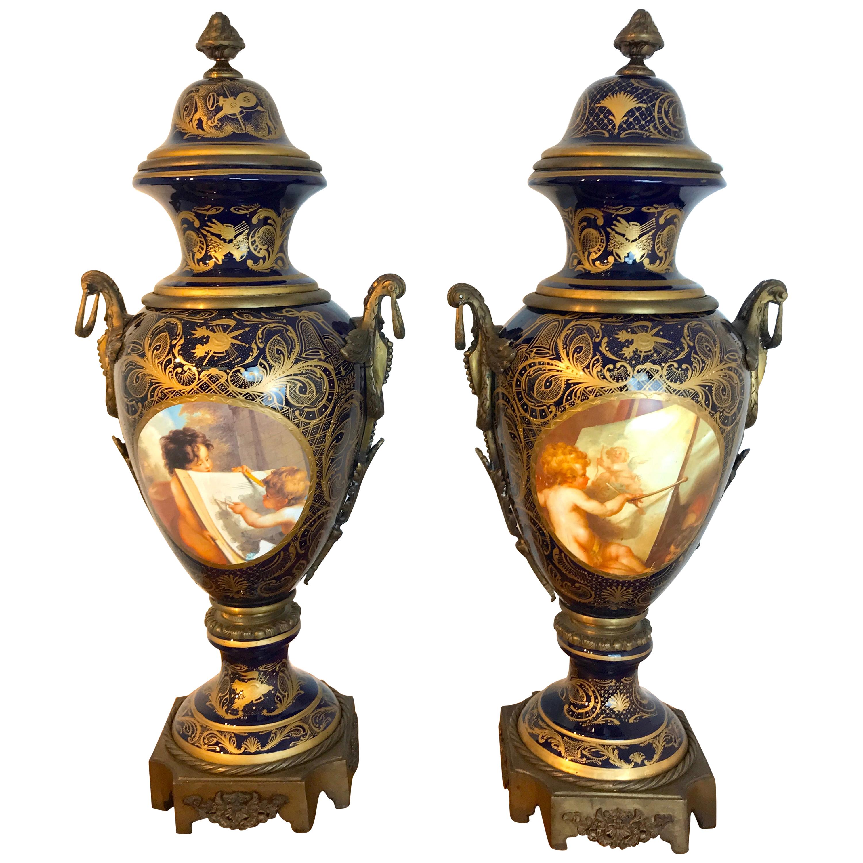 Pair of Palace Size Sevres Style 'Labors of Cupid' Ormolu & Cobalt Urns For Sale