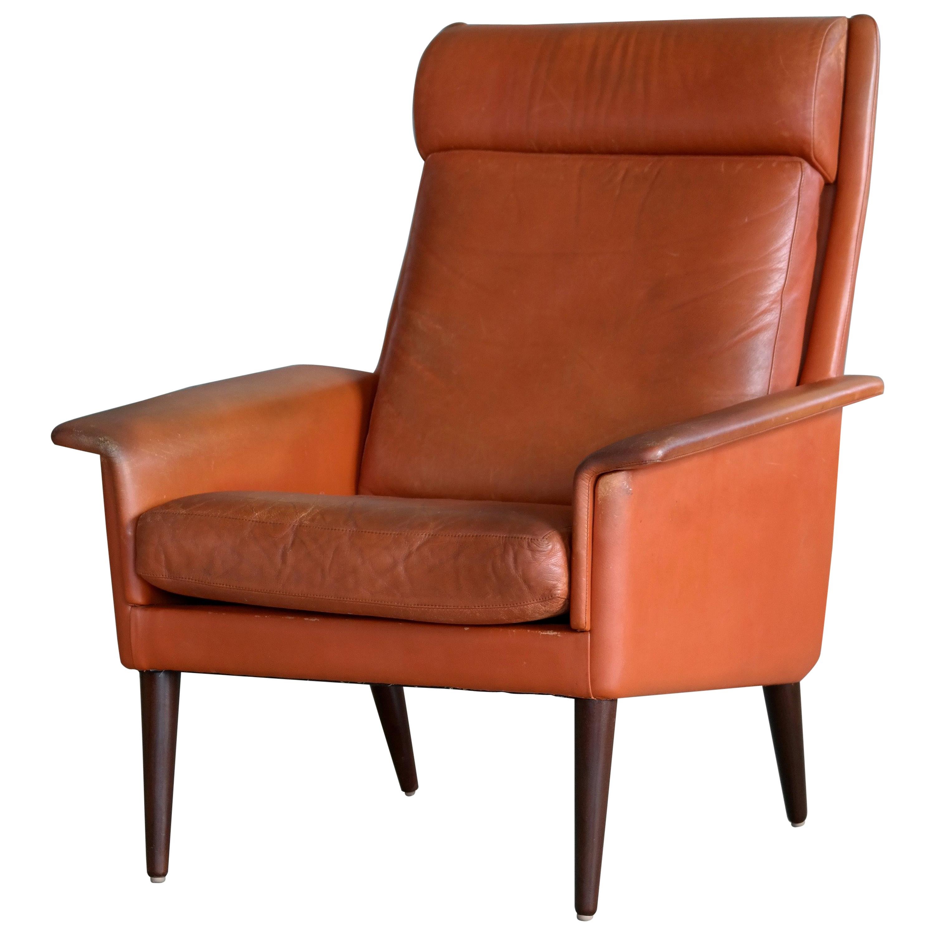 Danish Midcentury Cognac Colored High Back Lounge Chair by Sibast For Sale