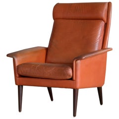 Fauteuil de salon danois à haut dossier de couleur cognac par Sibast, milieu du siècle