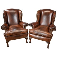 Antique 20th Century Pair of English Hand Dyed Conker Brown Leather Wingback Armchairs