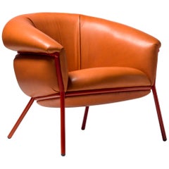 Ultra comfort armchair upholstered in leather and metal frame