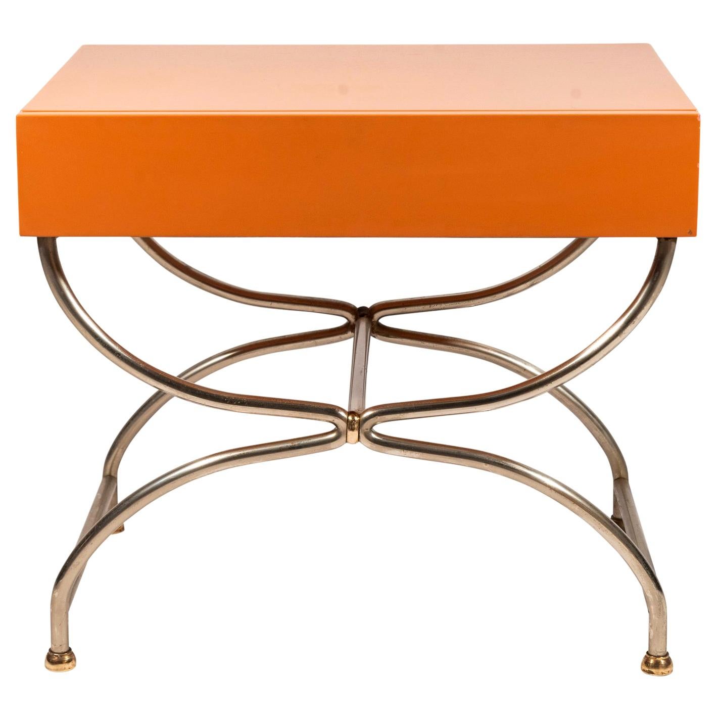 Pair of nightstands,
Orange lacquer and chromed iron,
France, circa 1970.

Measures: Width 54.5 cm, depth 39 cm, height 49 cm.