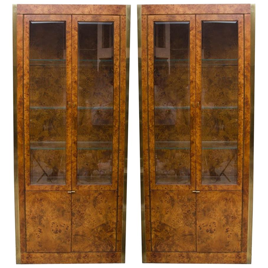 Pair of china vitrine cabinets by Tomlinson are an excellent example of their timeless quality and design. This rectangular top cabinet features two doors with glass panels and brass tone handles, opening to three glass shelves, over two additional
