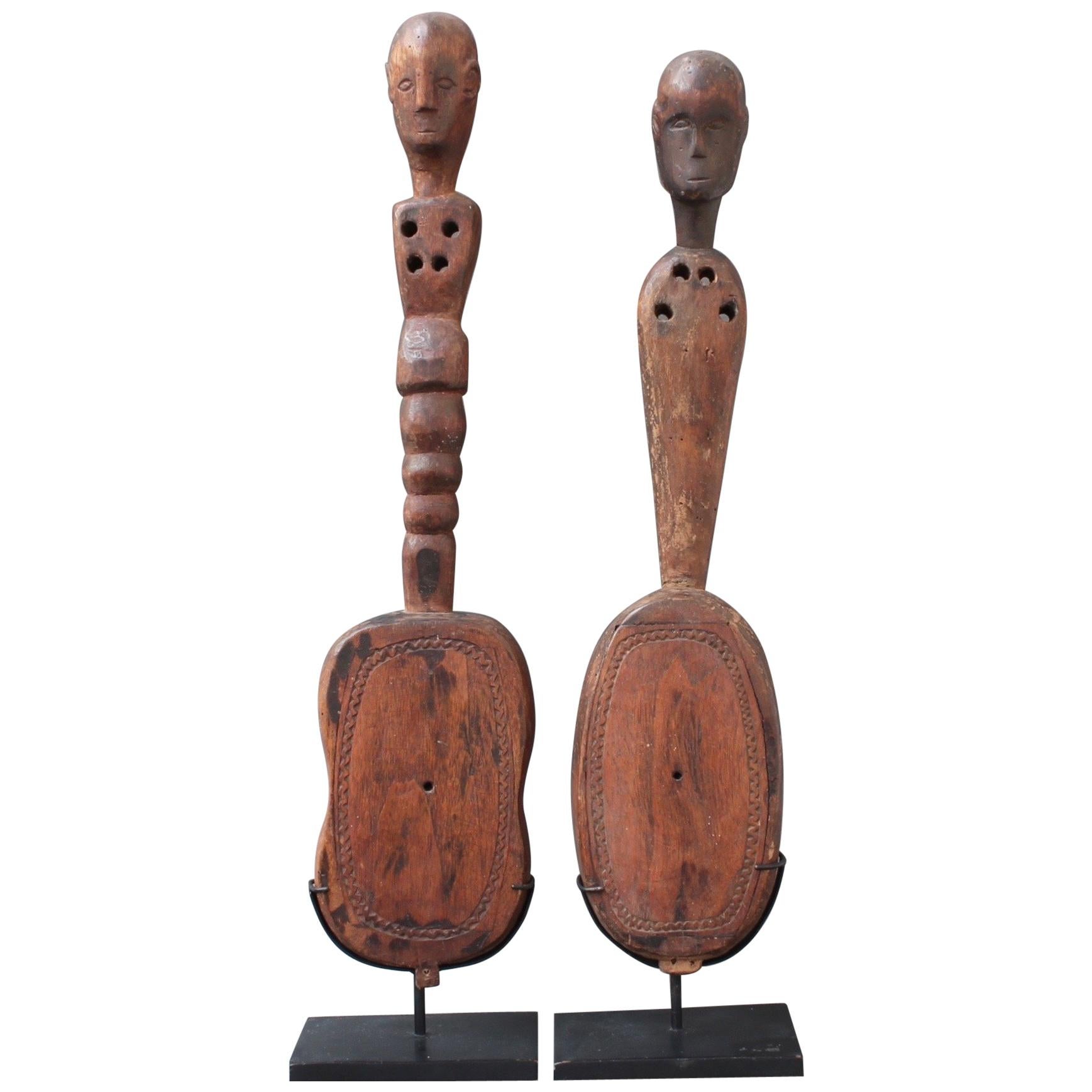 Pair of Hardwood Sumbanese Lutes with Anthropomorphic Figures, 20th Century