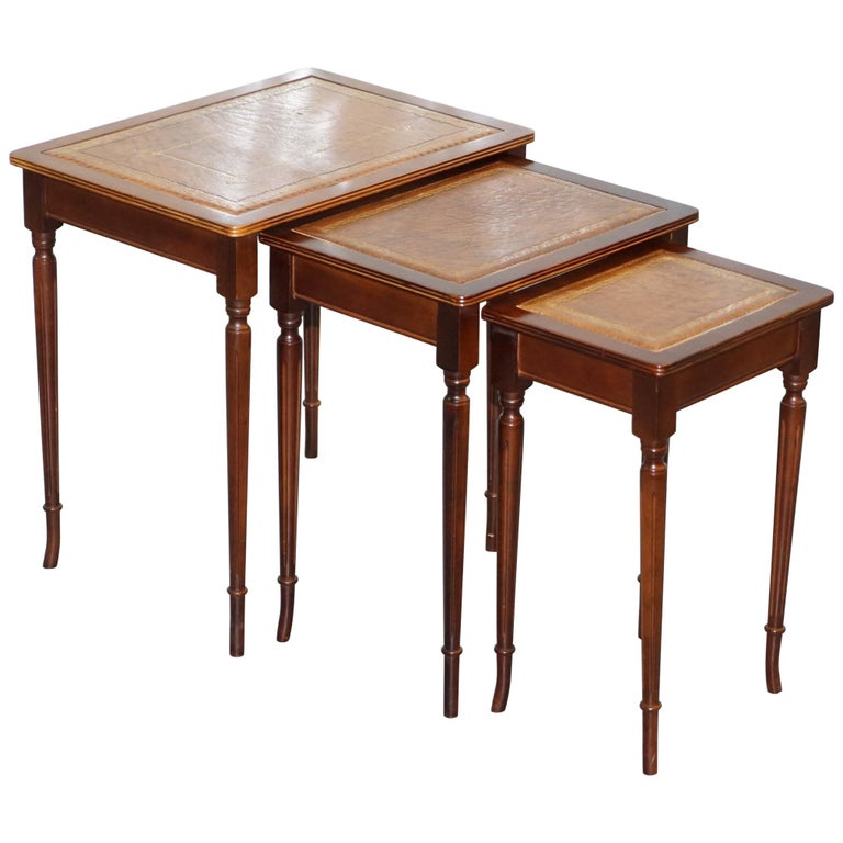 Nest of Three Mahogany with Brown Leather Top and Gold Leaf Embossed Side Tables at 1stDibs