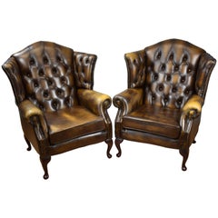 Pair of 20th Century Buttoned Back Leather Wing Back Armchairs