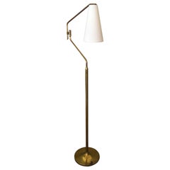 Tall Brass Floor Lamp with Adjustable Arm and Off White Fabric Cone Shade