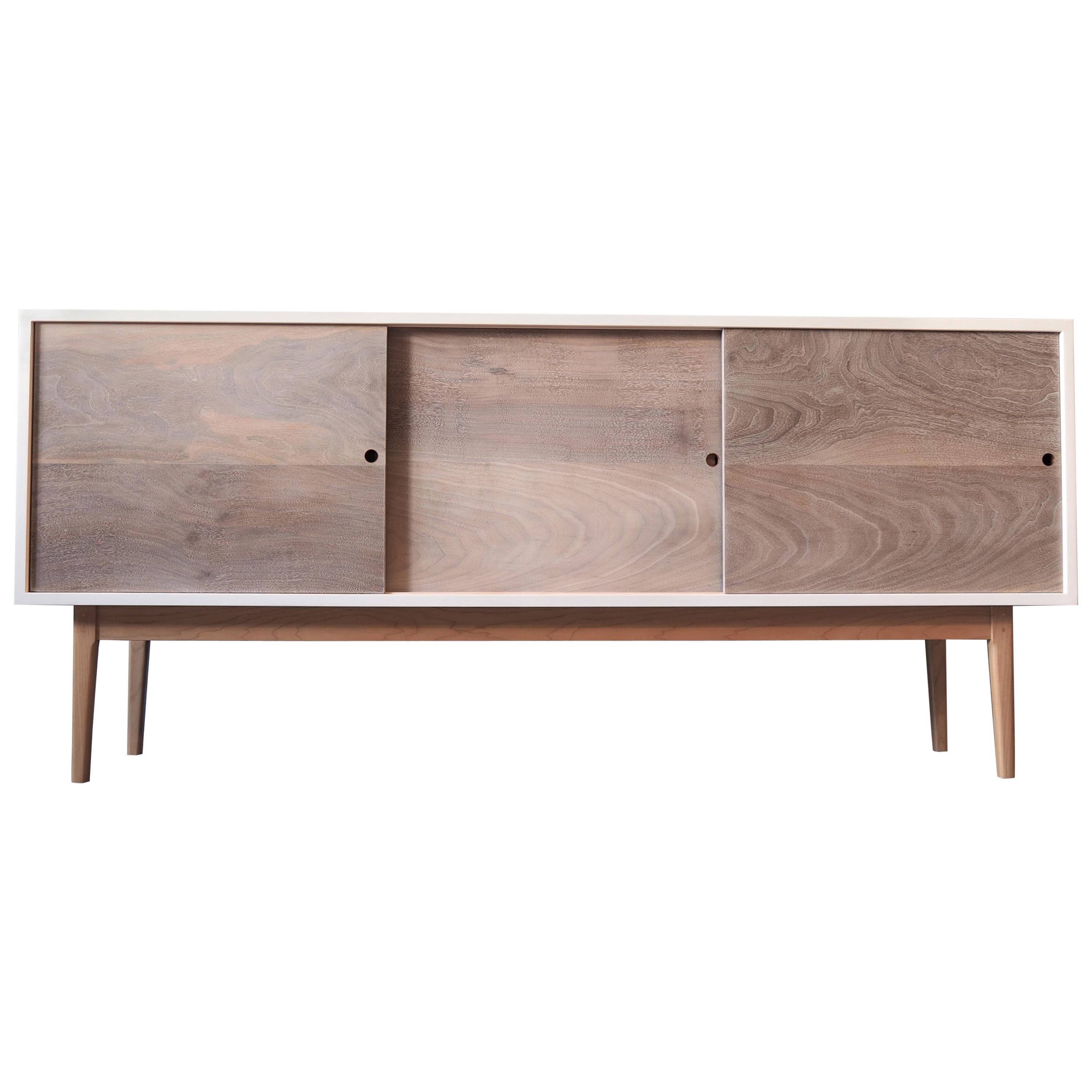 White Sideboard with Sliding walnut Doors and a solid maple base by MSJ Studio