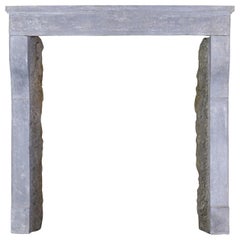 17th Century Small French Rustic Limestone Antique Fireplace Surround