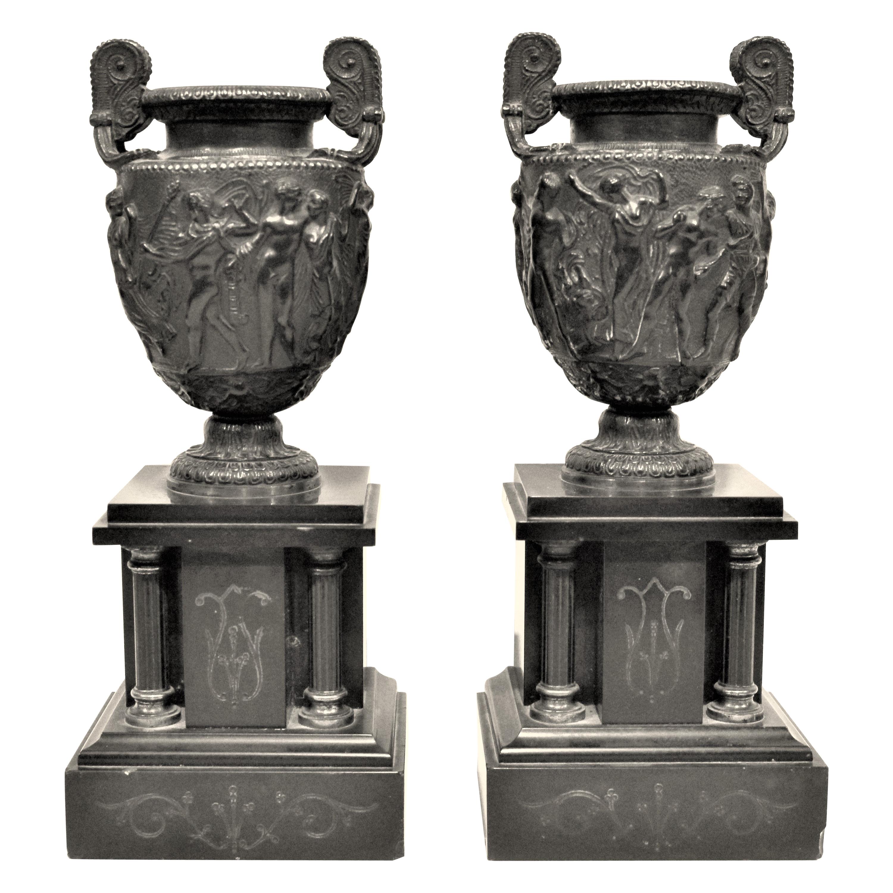Pair of Antique Cast Bronze and Polished Slate Pedestal Urns, or Garnitures