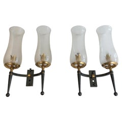 Coppia di lampade da parete in acciaio e metallo dorato con vetro di Murano color champagne