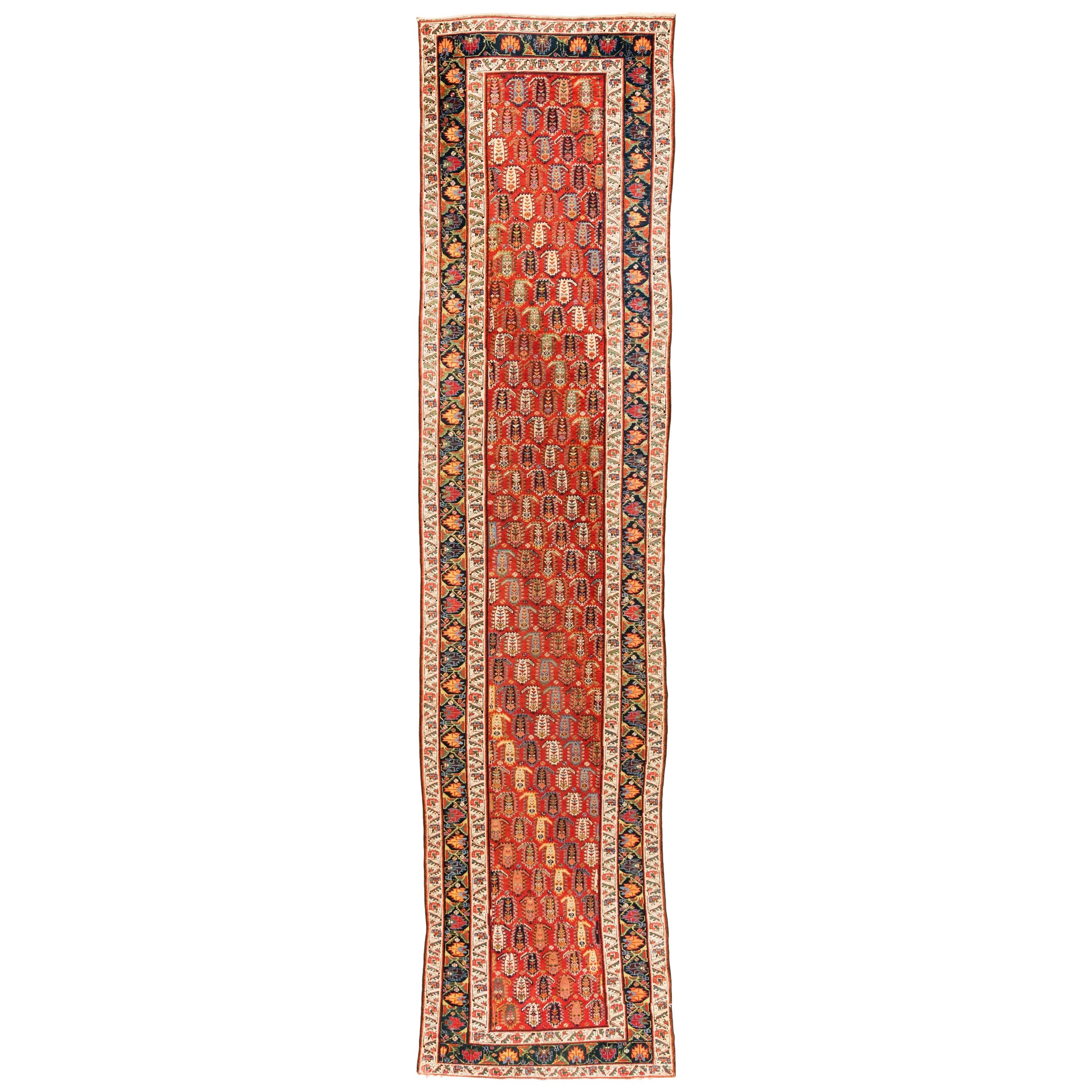 Antique Caucasian Genje Runner with Red, Green, Browns, and Blues Wool For Sale