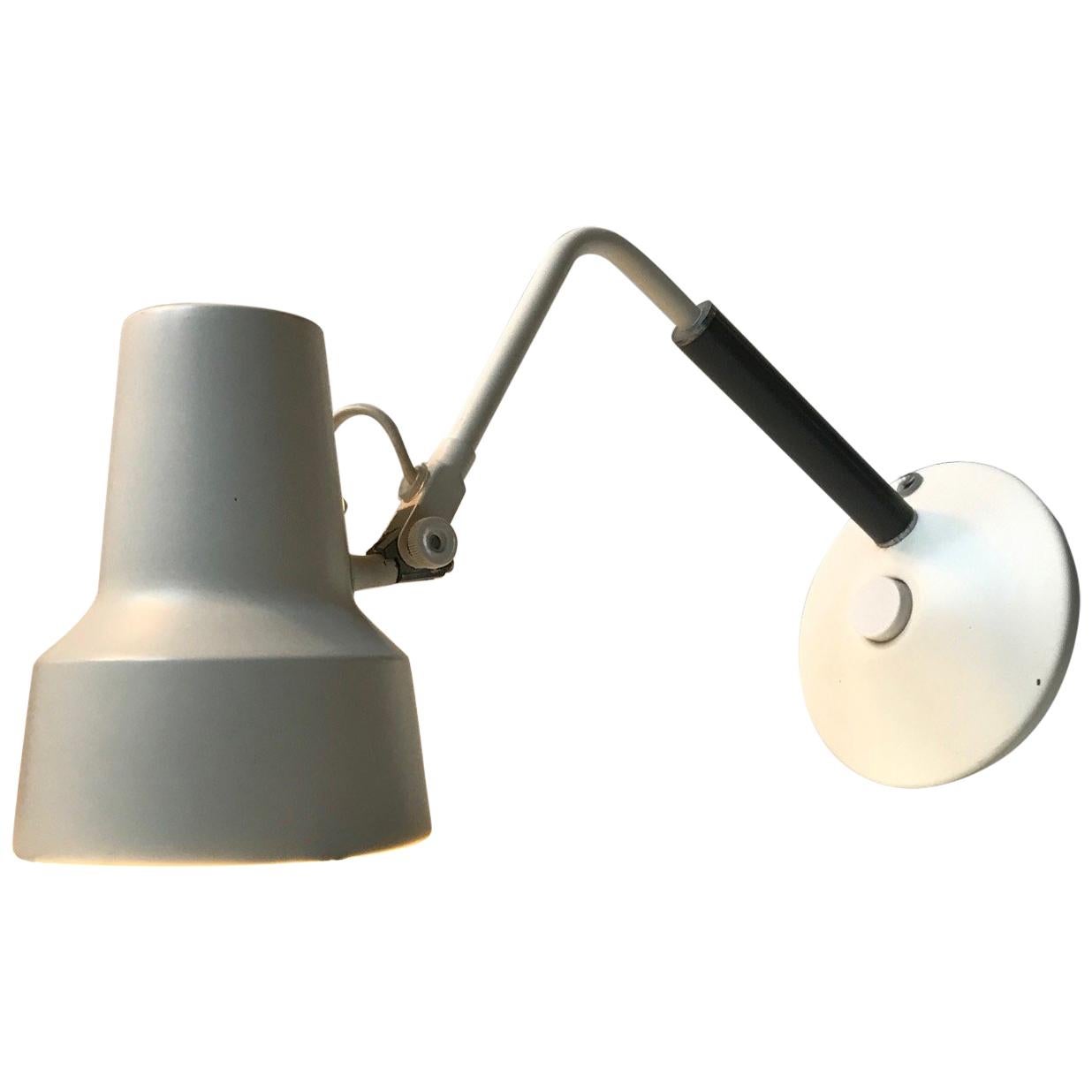 White and grey table lamp designed by Jac Jacobsen for his own company Jac Jacobsen A/S in Norway during the late 1950s. It is called L-11 and it features a grey acrylic handle, porcelain fitting, wall mount option, jumbo switch and adjustable