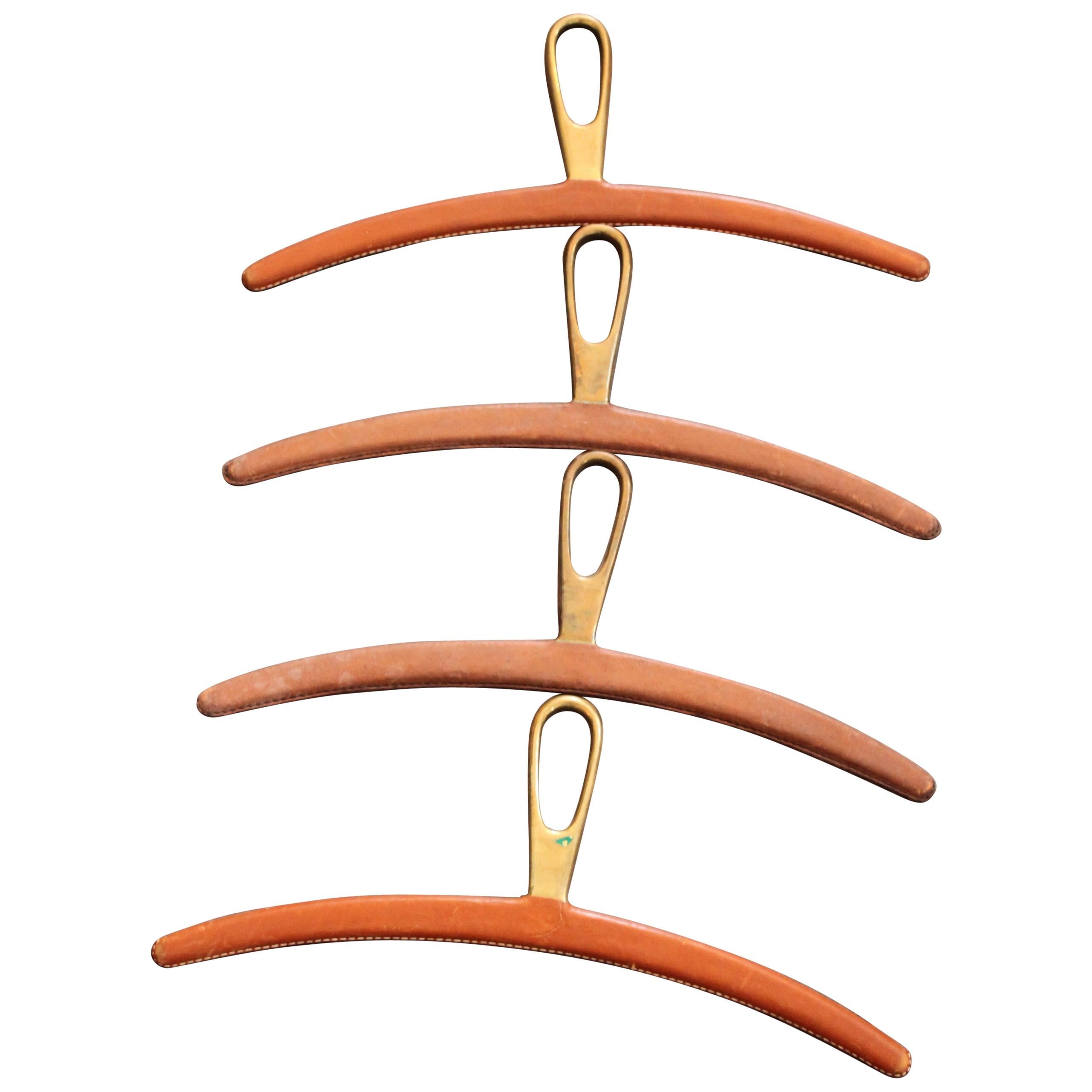 4 Leather-Coated Brass Coat Hangers by Carl Auböck For Sale