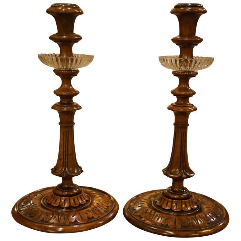 Pair of 19thc Carved Walnut Candlesticks with brass sockets and glass