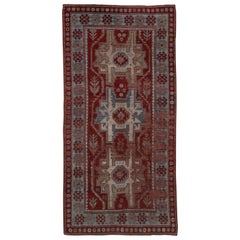 Alfombra kazaka antigua envejecida