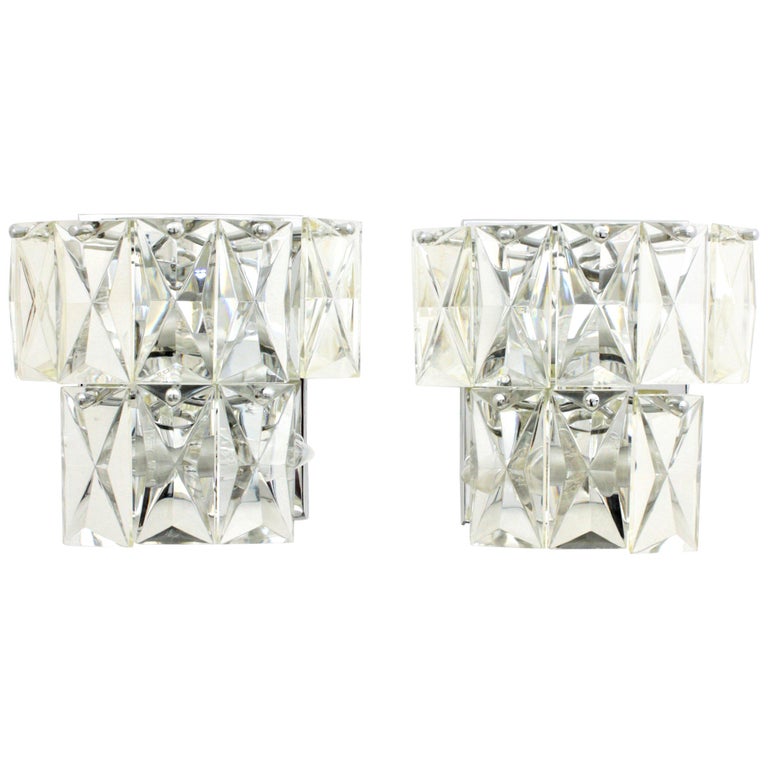 Pair of Mid-Century Modern French Baccarat Style Crystal Wall Lights
A pair of Mid-Century Modern Baccarat stylecrystal wall sconces. Each one is made by 8 rectangular shaped pieces and diamond shape cut on the frontal surface. All of them placed on