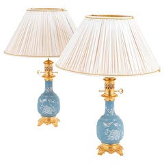 Pair of Blue Porcelain Lamps with a White Enameled Decor, circa 1880