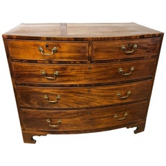 Antique English Bow Front Chest in Mahogany with Banded Top and Chippendale Pulls