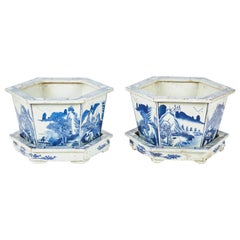 Pair of Chinese Blue and White Cachepots with Underplates