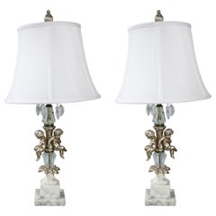 Pair of French Hollywood Regency Marble Base, Crystal, Gesso and Cherub Lamps