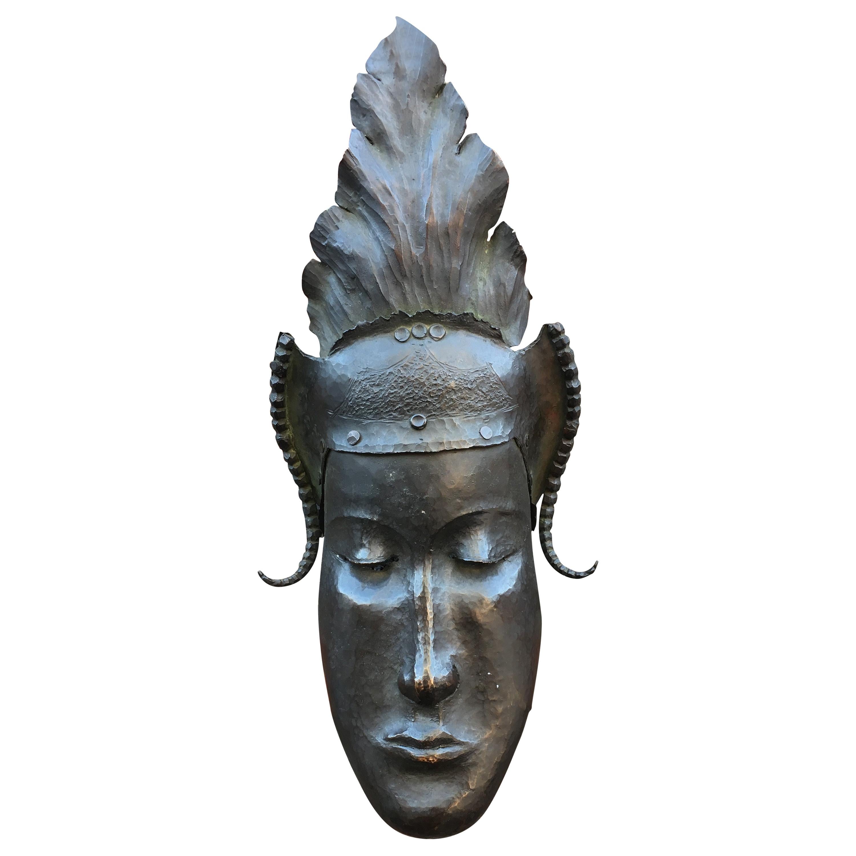 Heyndrickx, Art Deco Mask in Hammered and Patinated Bronze, Signed, Dated 1941 For Sale