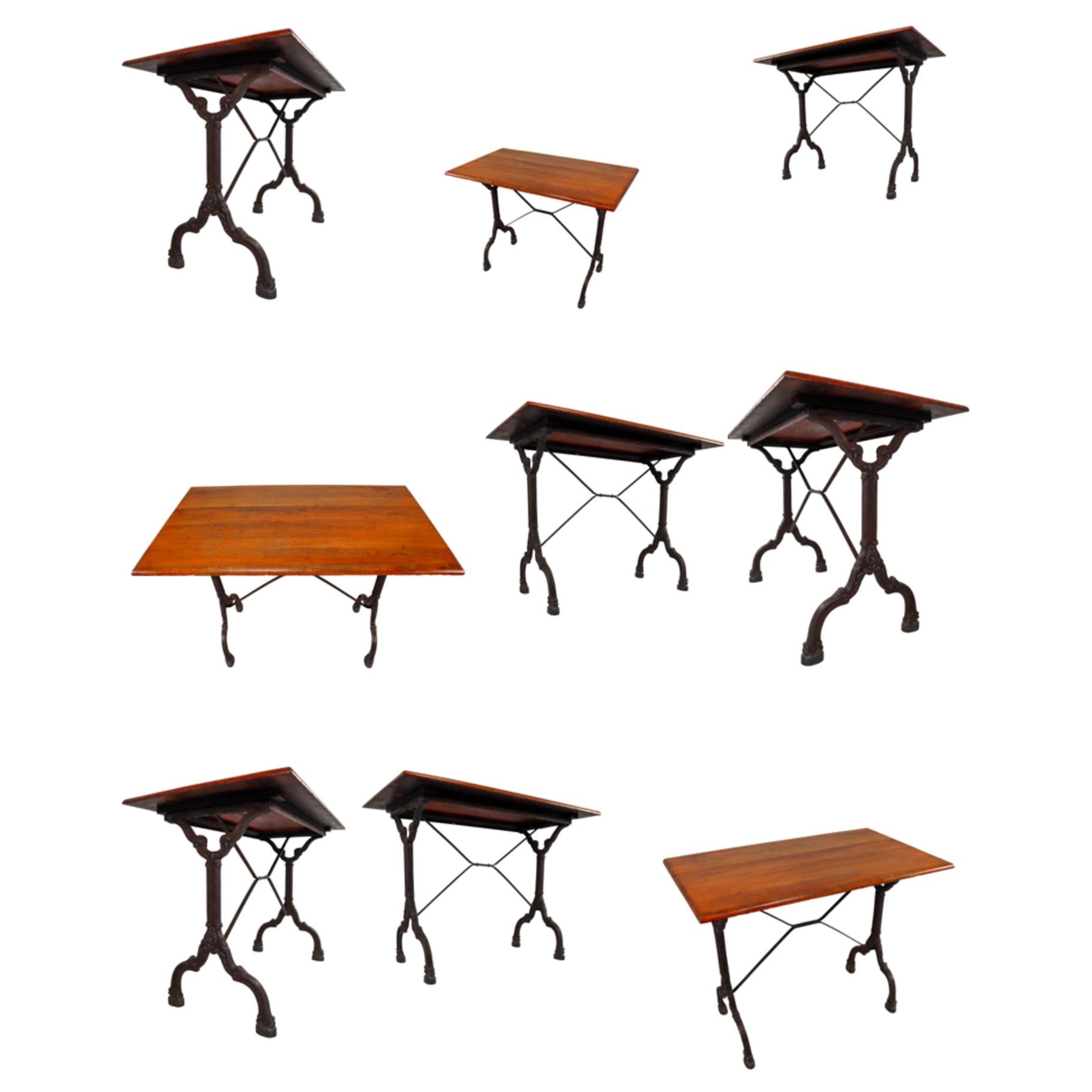 Nine Cast Iron Bistro Tables or Cafe Tables with Patinated Oak Top, France, 1900