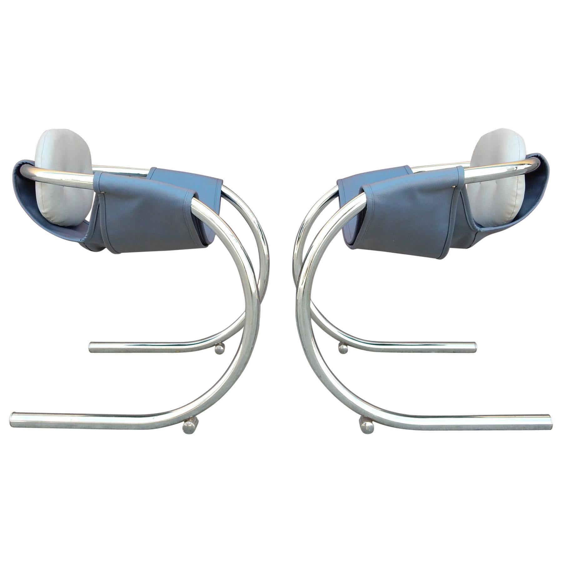 Pair of fat chrome-plated steel tube sling lounge chairs designed by Byron Botker for Landes of California.
Very comfortable and super cool. New premium vinyl sling in 2-tone steel blue and silver.
Solid chairs ready for use.