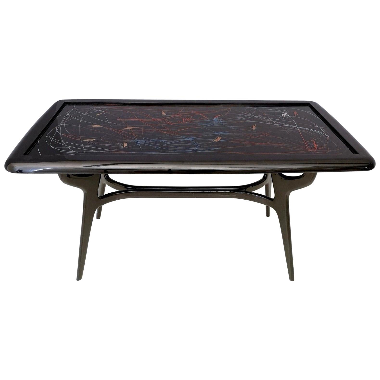 This table features an ebonized wood frame, which is original from the 1950s.
The edge and the glass top have been designed and lacquered by Enzio Wenk, in 2019.
It is in excellent original condition and ready to become a piece in a home.

Measures: